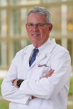 Dr Michael Koch wearing white coat