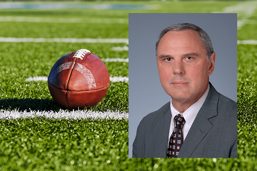 Dr Kovacs headshot with football field background