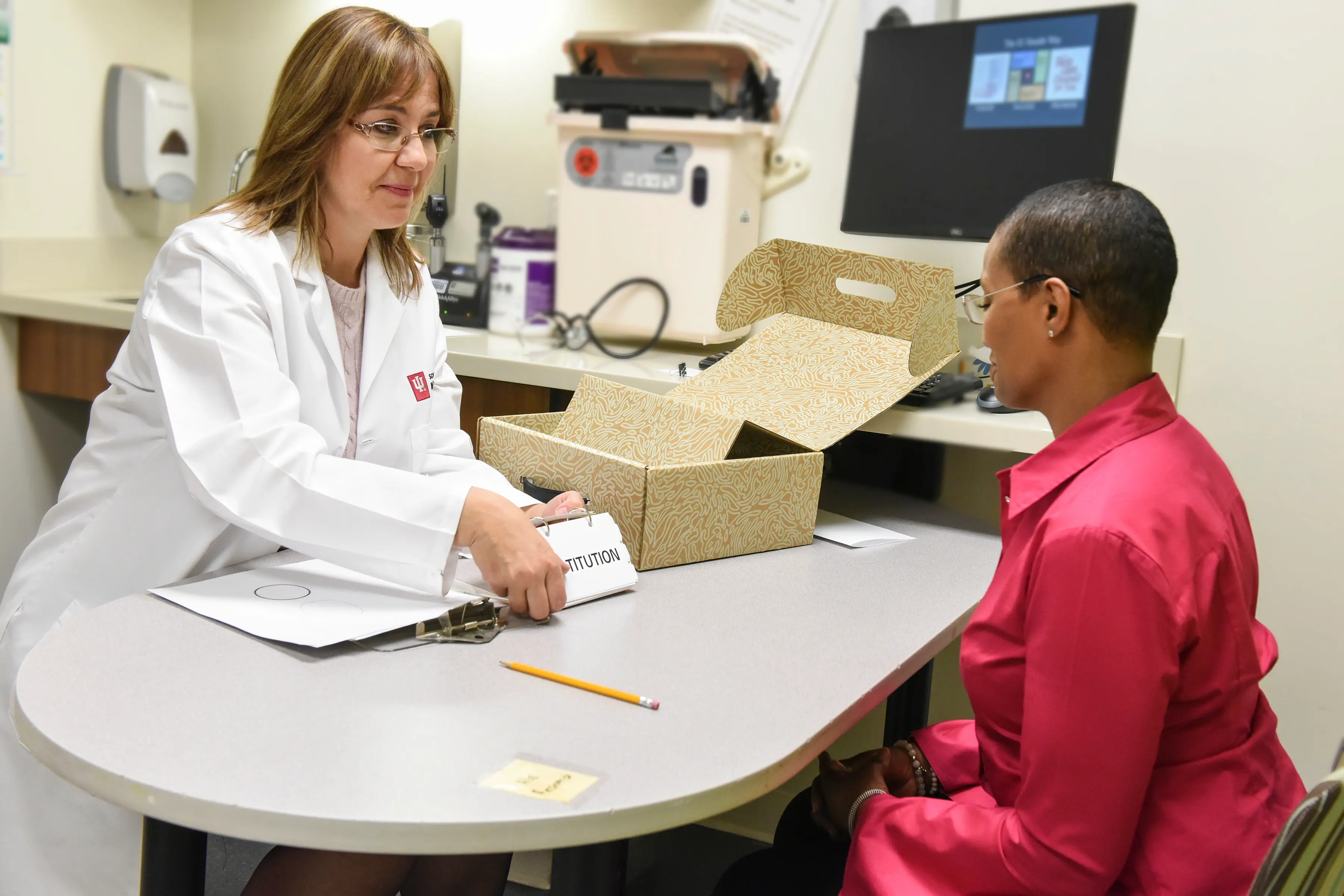 Liana Apostolova works with a LEADS study participant.