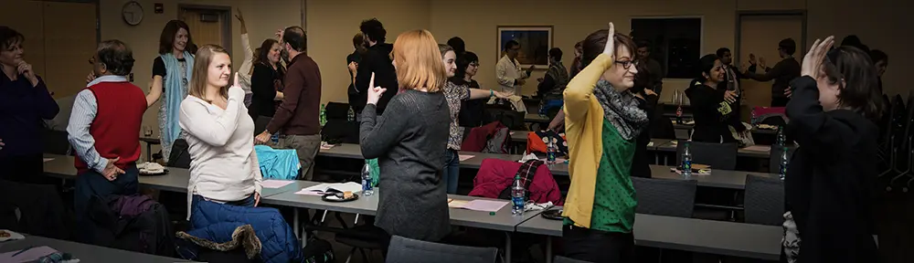 Faculty and staff participate in The Mirror exercise during a past improv exercise at IU School of Medicine.