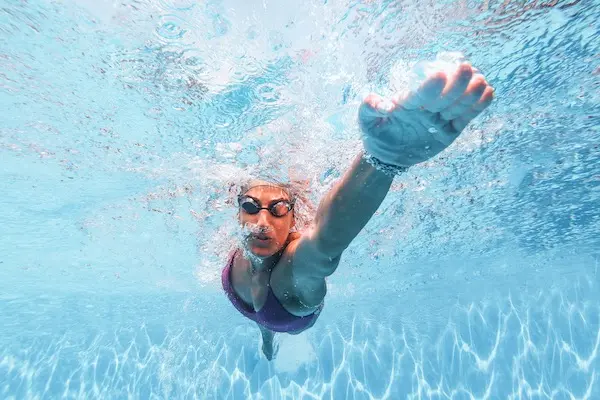 Woman swimming in pool