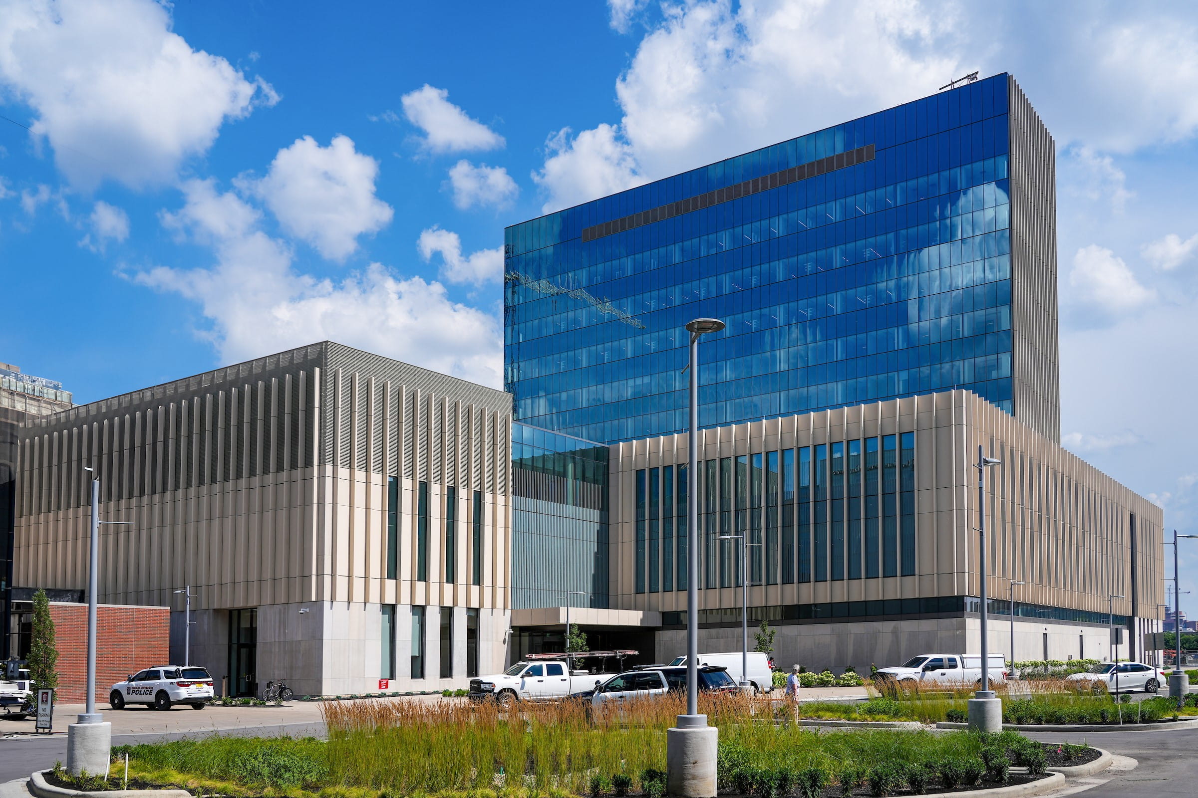 exterior of the Medical Education and Research building, with blue sky and puffy clouds in the background