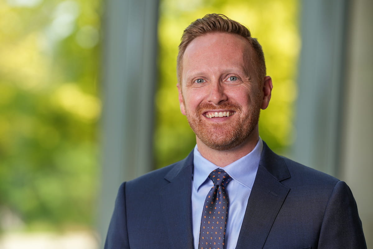 Portrait of Zachary Adams wearing suit and tie