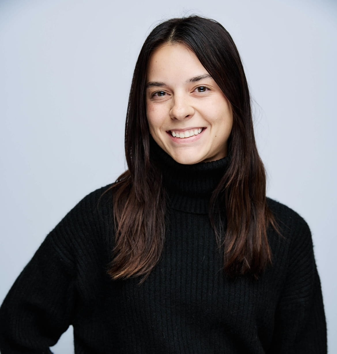 headshot of Cassidy Butler, woman with light skin and dark hair dressed in black 