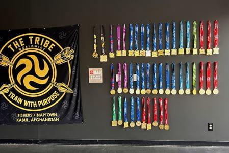 Dozens of Conboy's medals hang on the wall at Naptown Brazilian Jiu-Jitsu