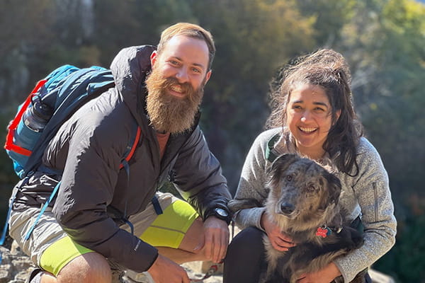 Contreras Burrola (right) poses with her husband, Nick Schwartz, and dog, Moss.
