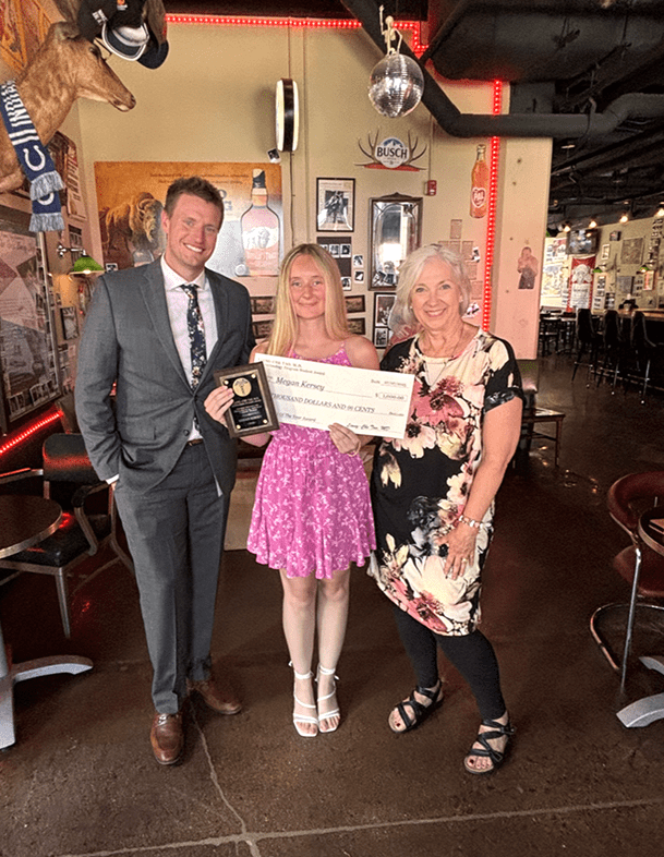 Student Megan Kersey holds her award