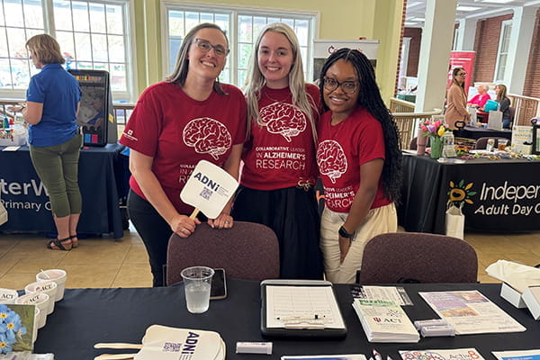 Zipporah Melton with other neurology staff members at a community outreach event