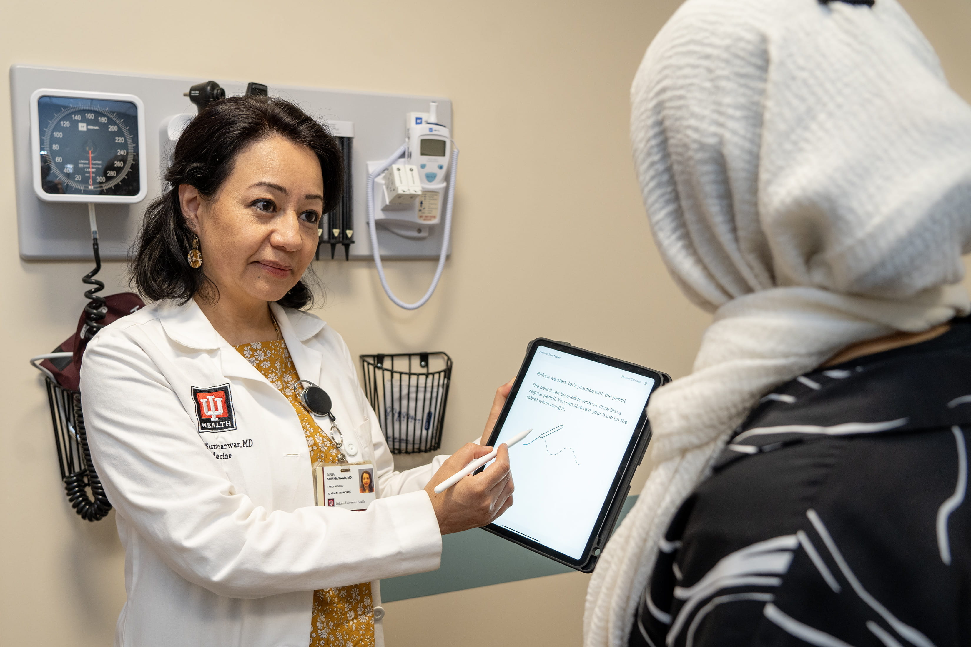 Diana Summanwar demonstrates the digital cognitive assessment tool. 