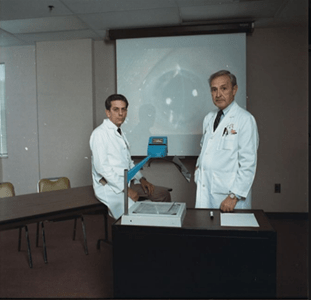 Forrest “Daryel” Ellis, MD (right) and Martyn Wills, MD (left), Indiana University School of Medicine Department of Pediatric Ophthalmology, 1989.