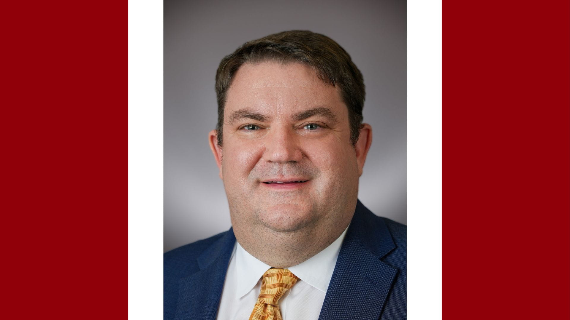 A headshot of John T. Lind, MD