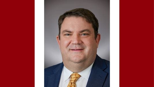 A headshot of John T. Lind, MD