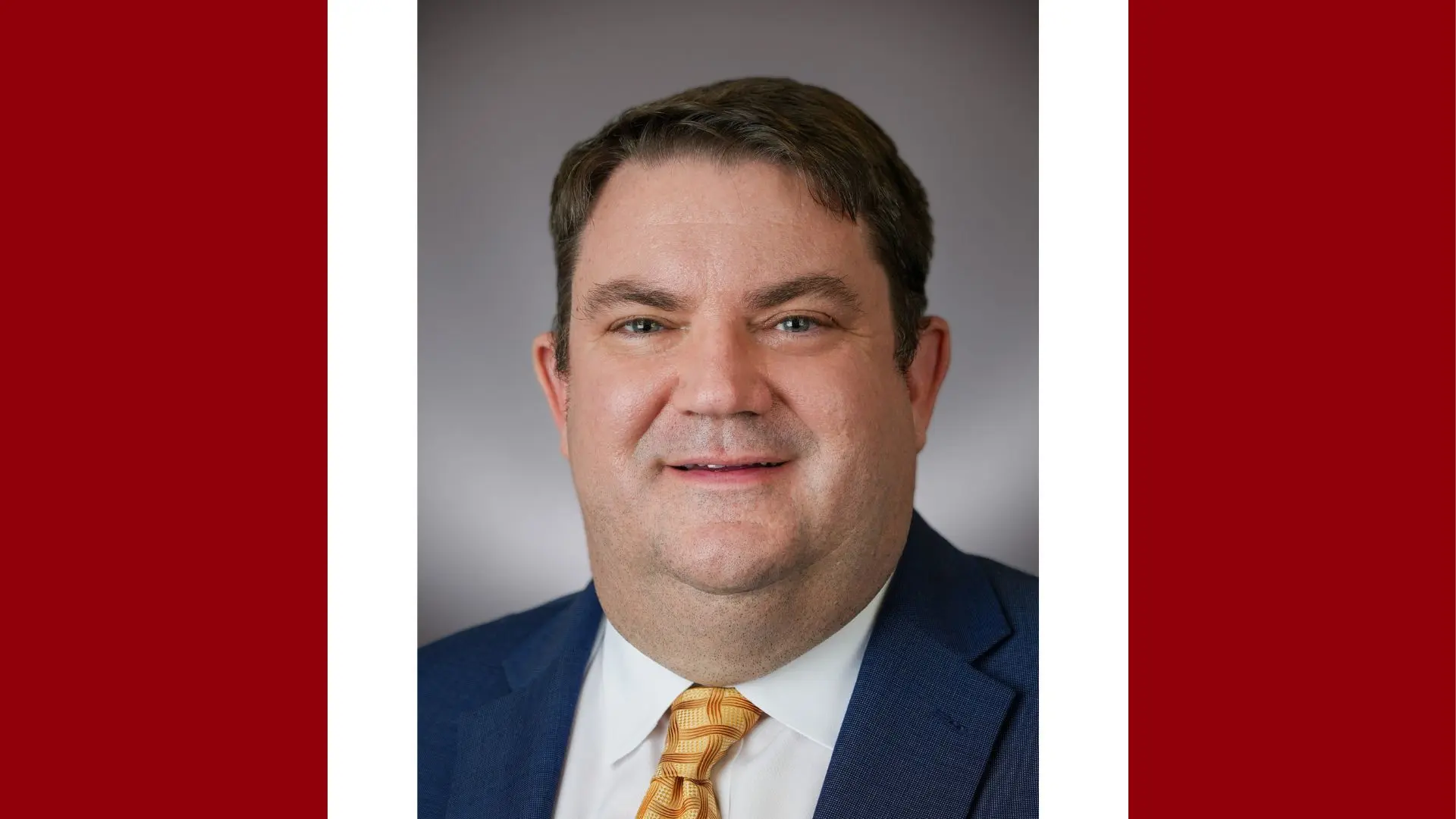 A headshot of John T. Lind, MD