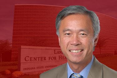 Headshot of Peter Duong with red landscape background