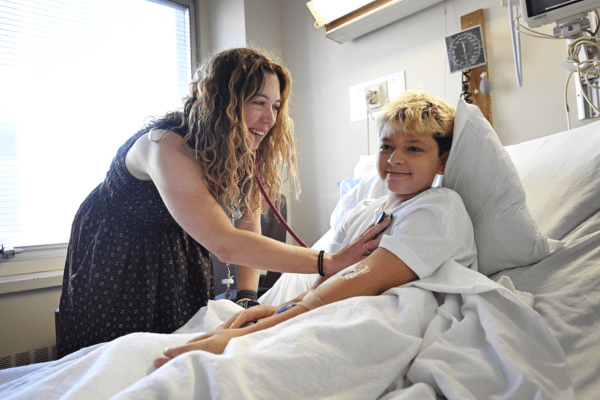 Heath Davis receiving a health exam by Emily K. Sims