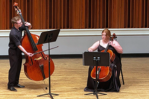 Riley Keller and Rebekah White play their instruments on-stage at the 2025 Evening of the Arts.