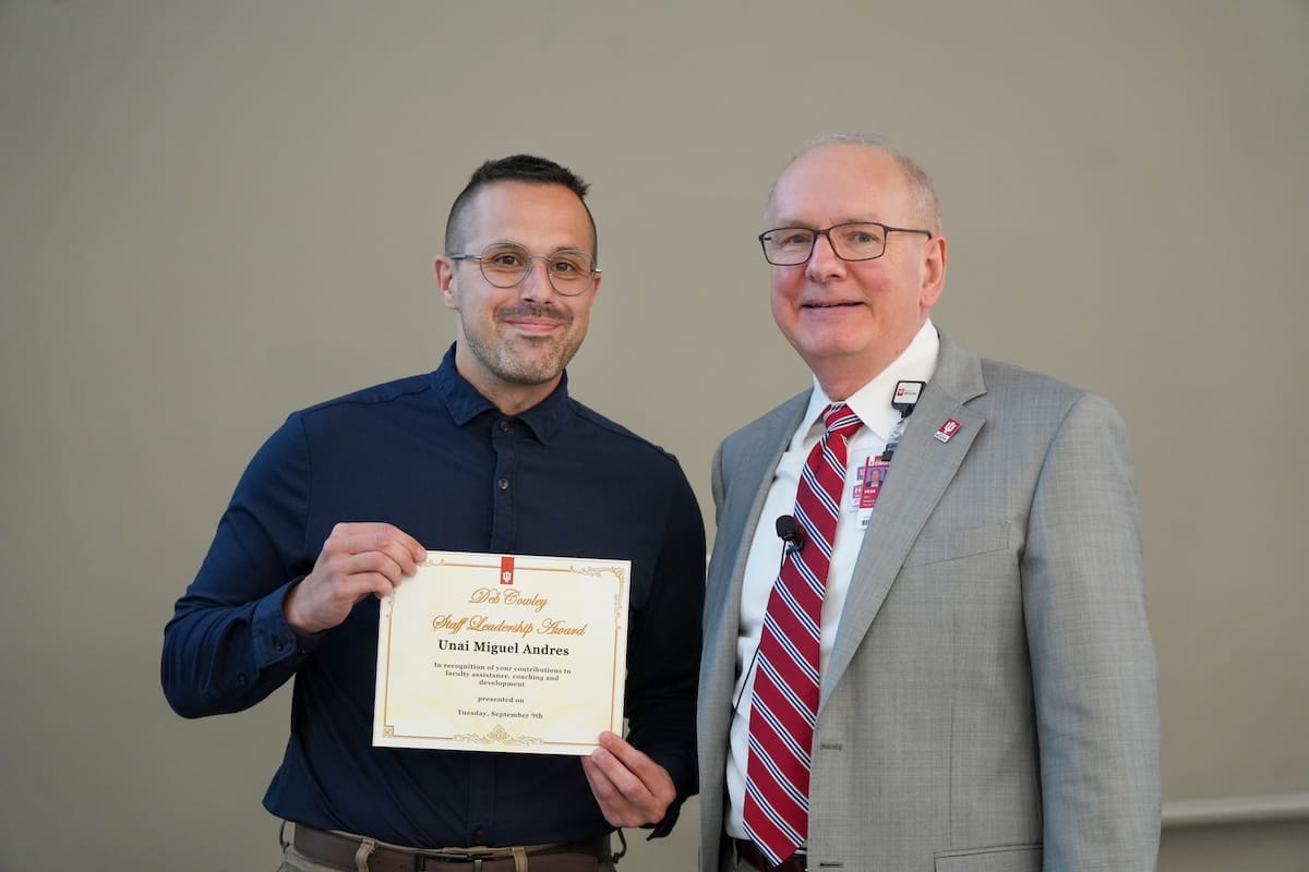 Unai Miguel Andres holds his award and stands with Dean Hess