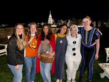 Sarah Vaught poses with four other female medical students, wearing Halloween costumes