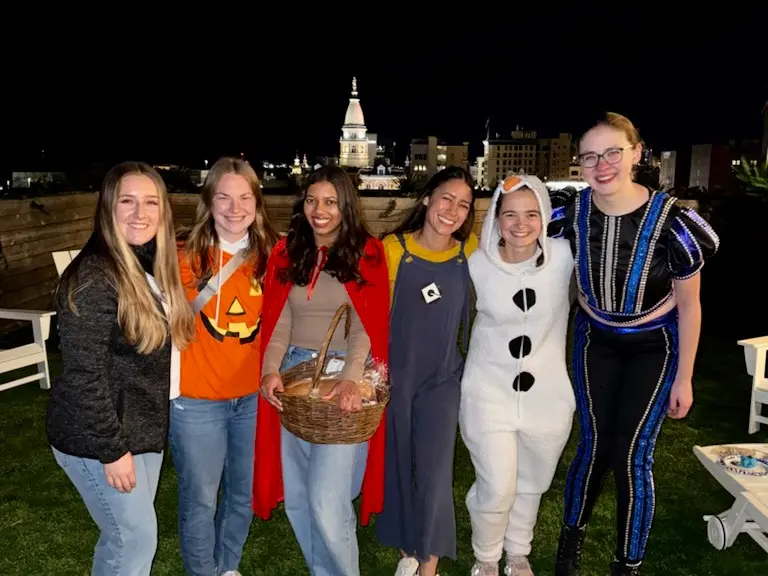 Sarah Vaught poses with four other female medical students, wearing Halloween costumes