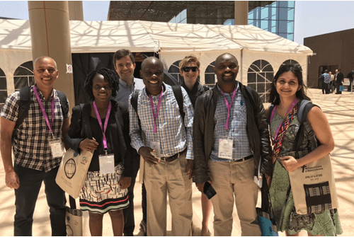 Chandy John (far left) with fellow IU and Global Health Uganda scientists at the Pan-African Malaria Conference in Dakar, Senegal in 2018 posed group photo of IU and Global Health Uganda scientists at the Pan-African Malaria Conference in Senegal in 2018