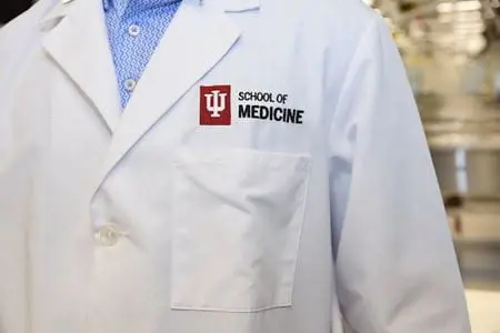 An IU School of Medicine branded white labcoat
