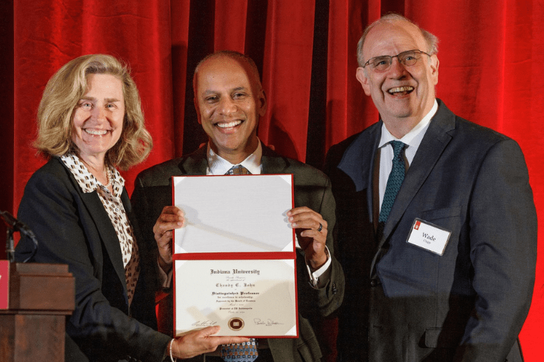 Pamela Whitten, Chandy John and Wade Clapp posing for a photo at a recognition event
