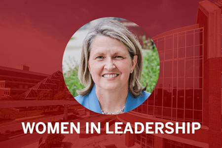 Lisa Landrum headshot with red background and words: Women in Leadership