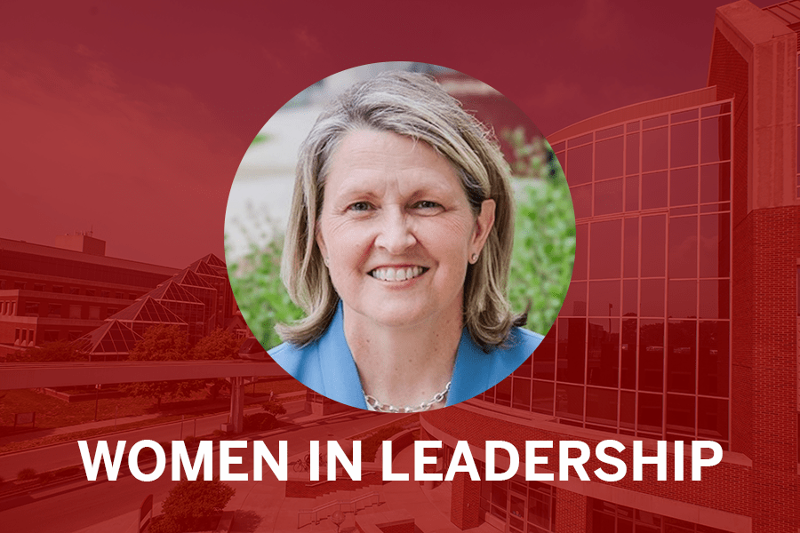 Lisa Landrum headshot with red background and words: Women in Leadership