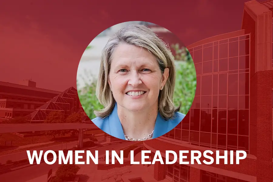 Lisa Landrum headshot with red background and words: Women in Leadership