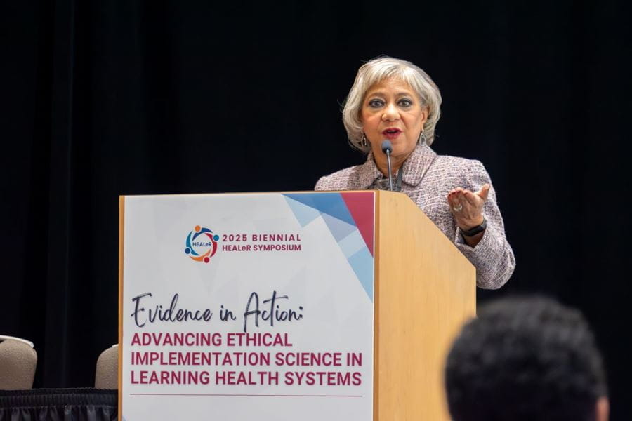 Afternoon keynote Lisa Cooper, MD, MPH, presents the case for implementation science and CBPR to achieve health equity. | Photo by Ryan Liggett, courtesy of Regenstrief Institute lisa cooper speaks at a podium