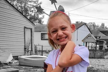 Madison smiling--blonde girl in color with black-and-white background