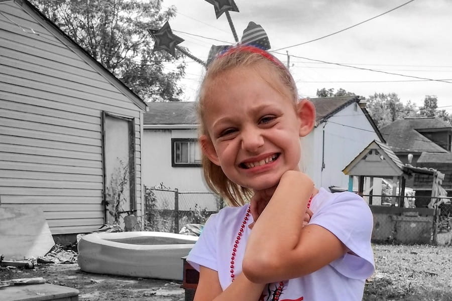 Madison smiling--blonde girl in color with black-and-white background