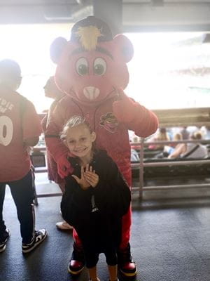 Madison Hardman at an Indianapolis Indians game with mascot Rowdie.