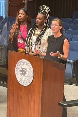 Presenters discussing the Non-Fatal Shooting and Advocacy Support Program. From left: advocate supervisor Antonia Bailey, local advocate DeAndra Dycus and gun violence researcher Lauren Magee. | Photo courtesy of Lauren Magee, IU School of Medicine Three presenters discussing the Non-Fatal Shooting and Advocacy Support Program.