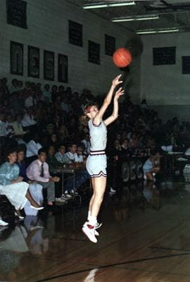 Lisa Landrum shooting a basketball during a game in the 1980s for Oklahoma Christian College.
