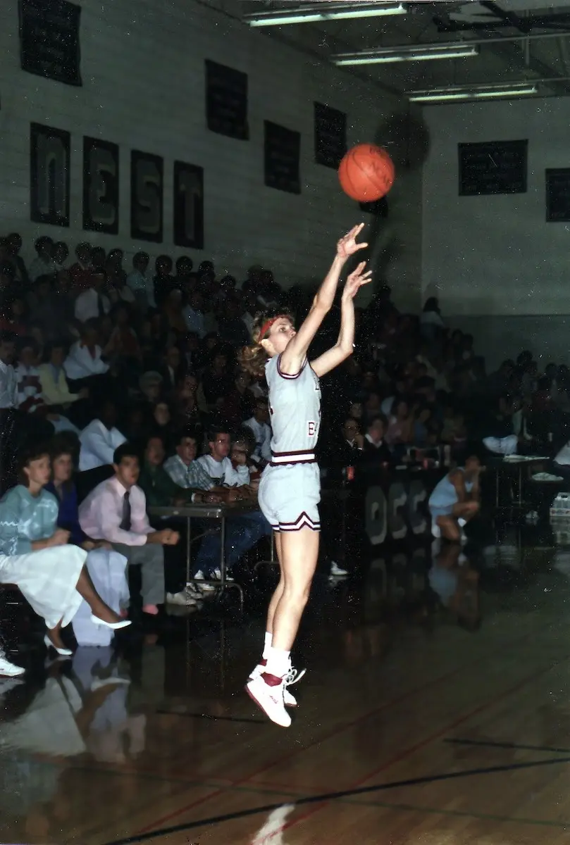 Lisa Landrum shooting a basketball during a game in the 1980s for Oklahoma Christian College.