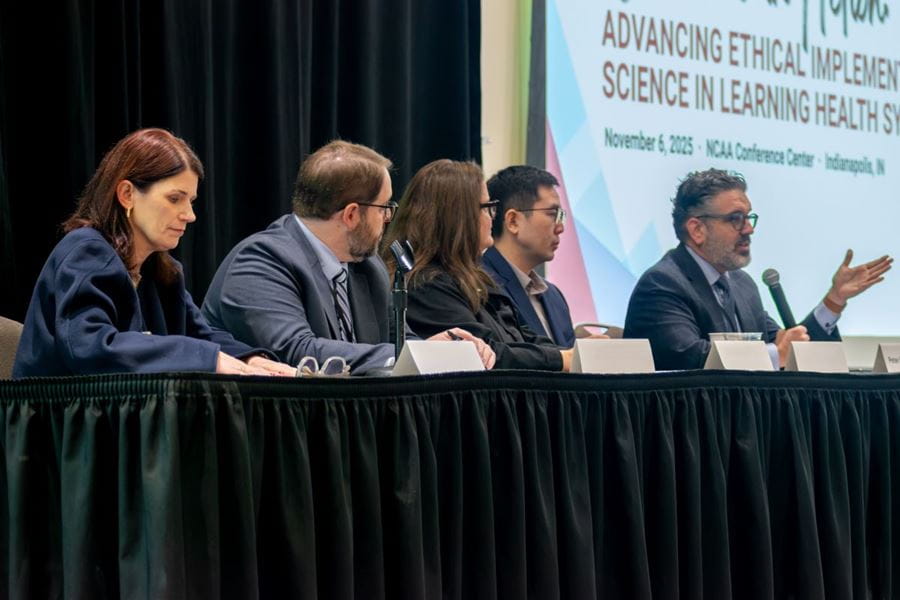 Panel 2 discusses how to make the case for the LHS as essential infrastructure. | Photo by Ryan Liggett, courtesy of Regenstrief Institute six panel members seated at a table on stage