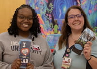 Photo of two people holding socks