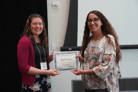 Rada Malko (right) receiving her poster award from Amelia Linnemann, PhD (left) at the 2024 Wells Center Retreat.