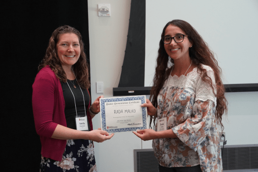 Rada Malko (right) receiving her poster award from Amelia Linnemann, PhD (left) at the 2024 Wells Center Retreat.