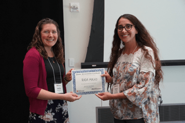 Rada Malko (right) receiving her poster award from Amelia Linnemann, PhD (left) at the 2024 Wells Center Retreat.