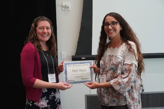 Rada Malko (right) receiving her poster award from Amelia Linnemann, PhD (left) at the 2024 Wells Center Retreat.