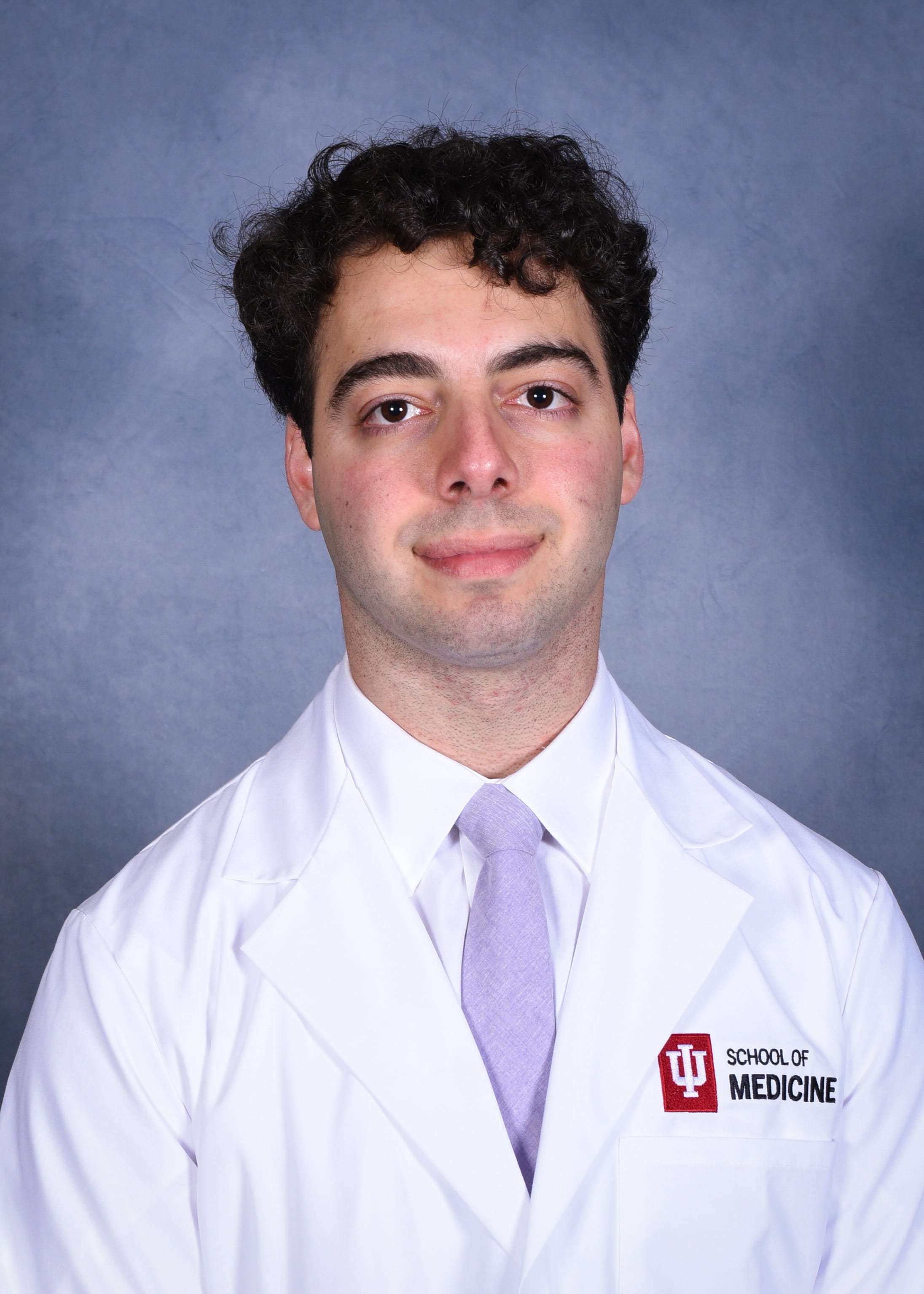 Christopher Rizkalli whitecoat headshot