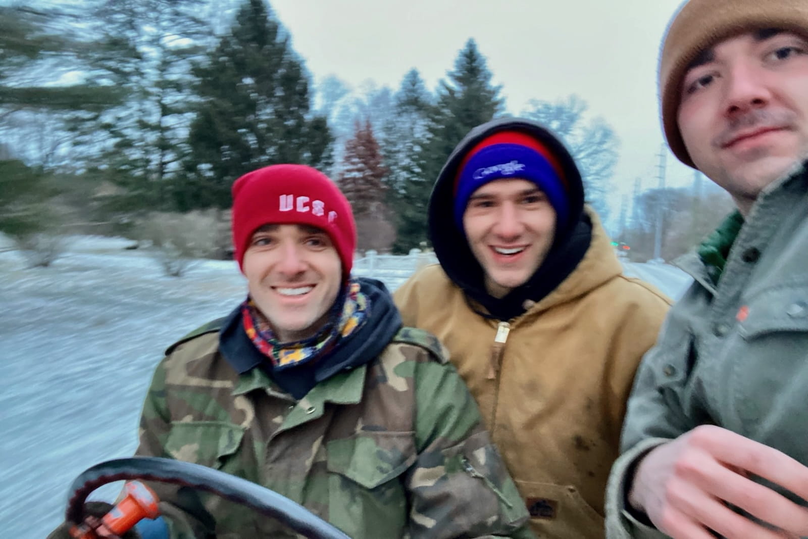 Oliver, Julian and Tristan Strobel take a old tractor for a spin on a snowy day.