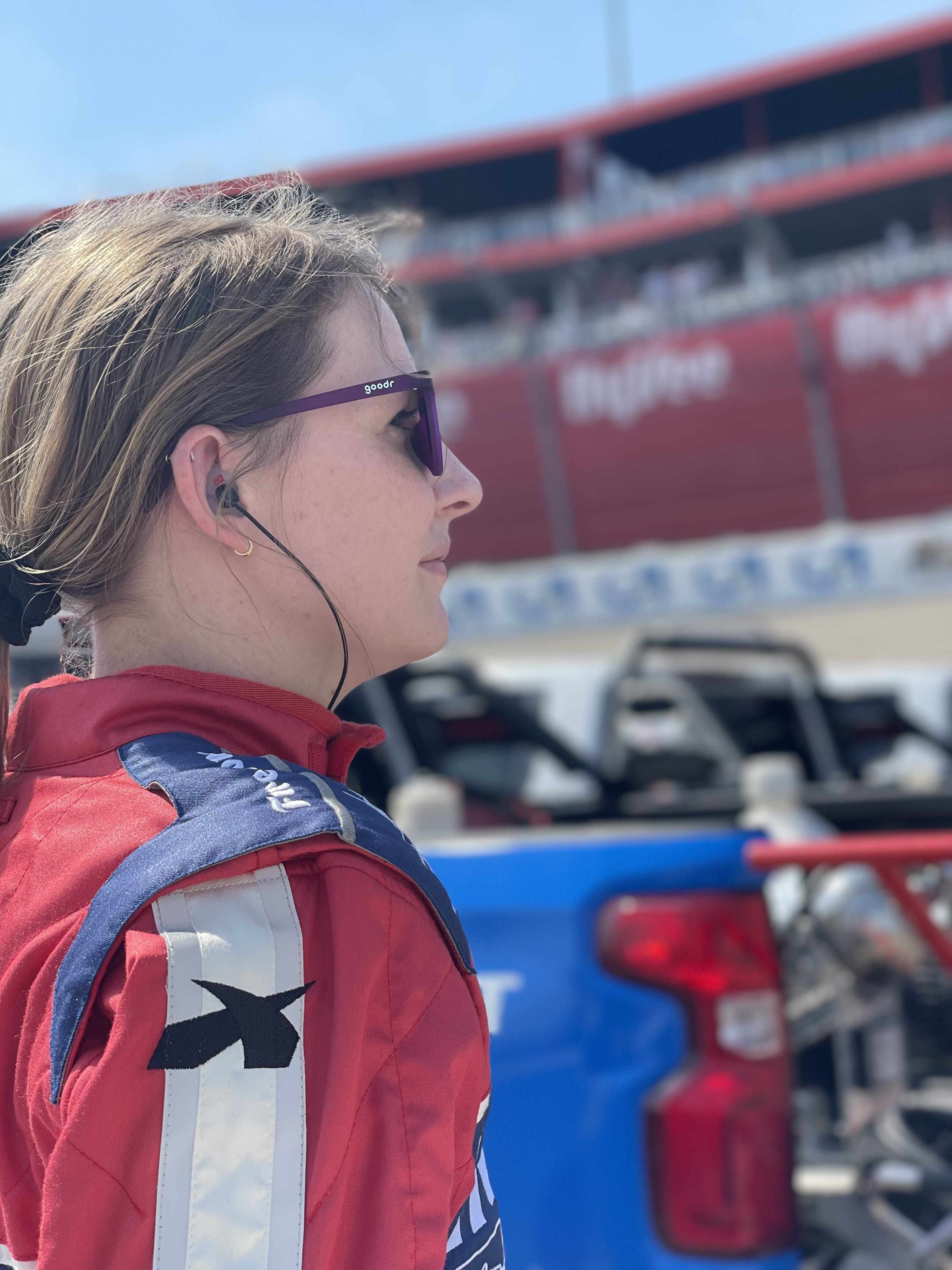 Profile of Liz Sullivan in her firesuit at IMS