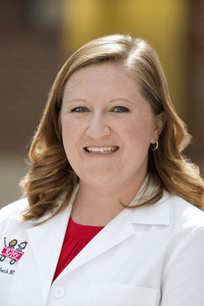 Headshot of Alyssa Swick, MD in her white coat with a Riley Logo. | Photo courtesy Alyssa Swick