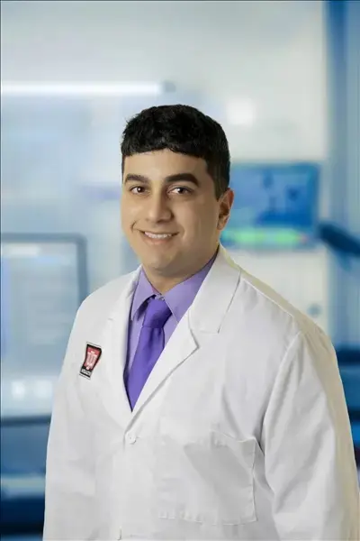 Arpan Prabhu portrait in white coat in hospital setting