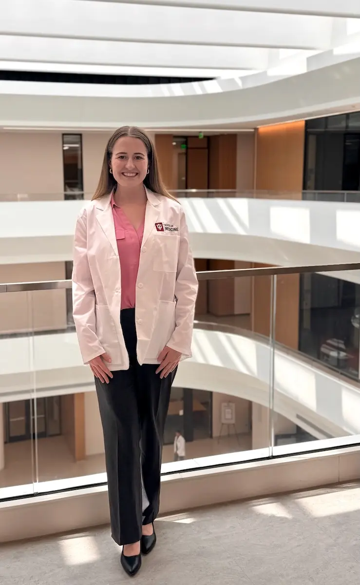 Sydney Clements wears her white coat in the Medical Education and Research Building