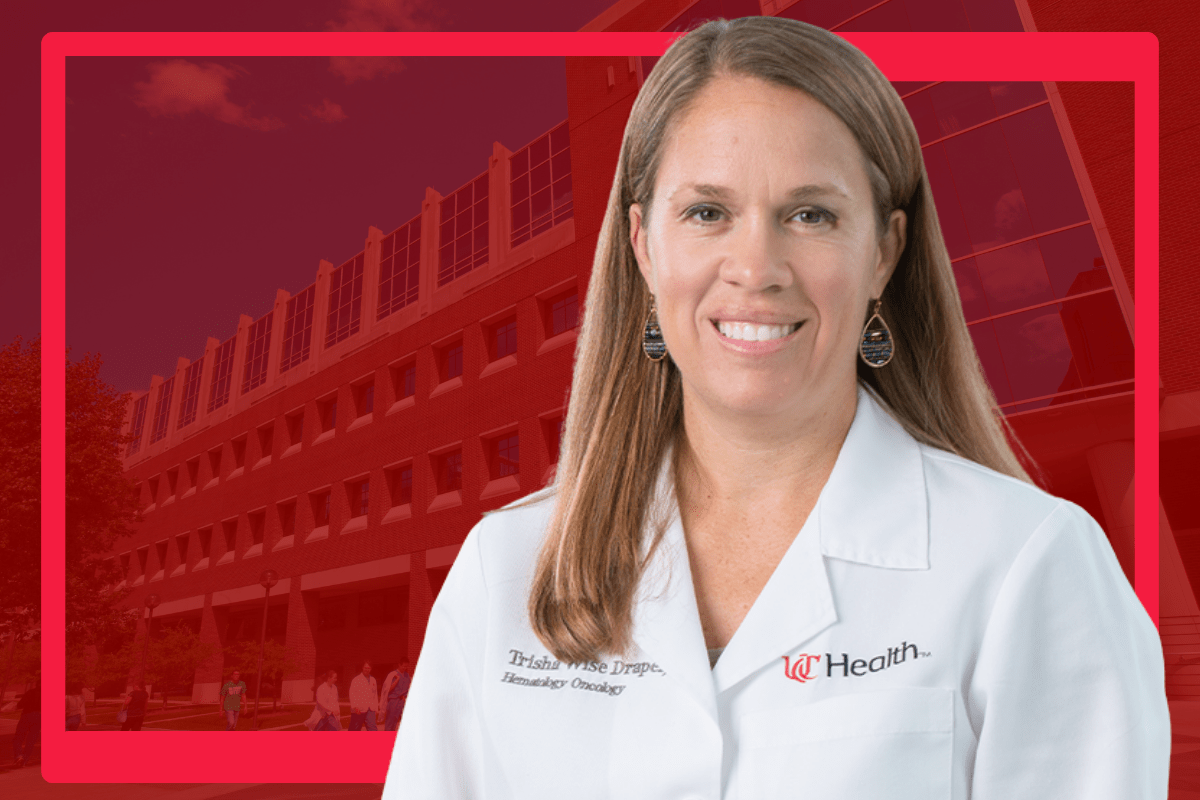 Trisha Wise-Draper portrait on a red background.