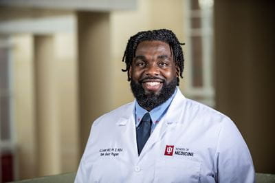 Russell Ledet in white coat